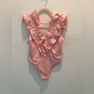 The WESTSIDE Ruffled Deep V bodysuit in Soft Pink